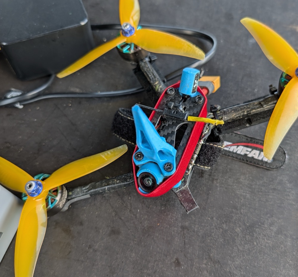 Drippuh racing frame showing broken carbon arm near motor mount after crash