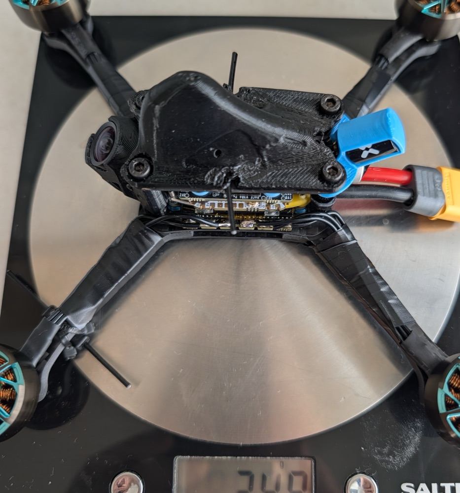 Drippuh race drone build on scale showing 248g without props